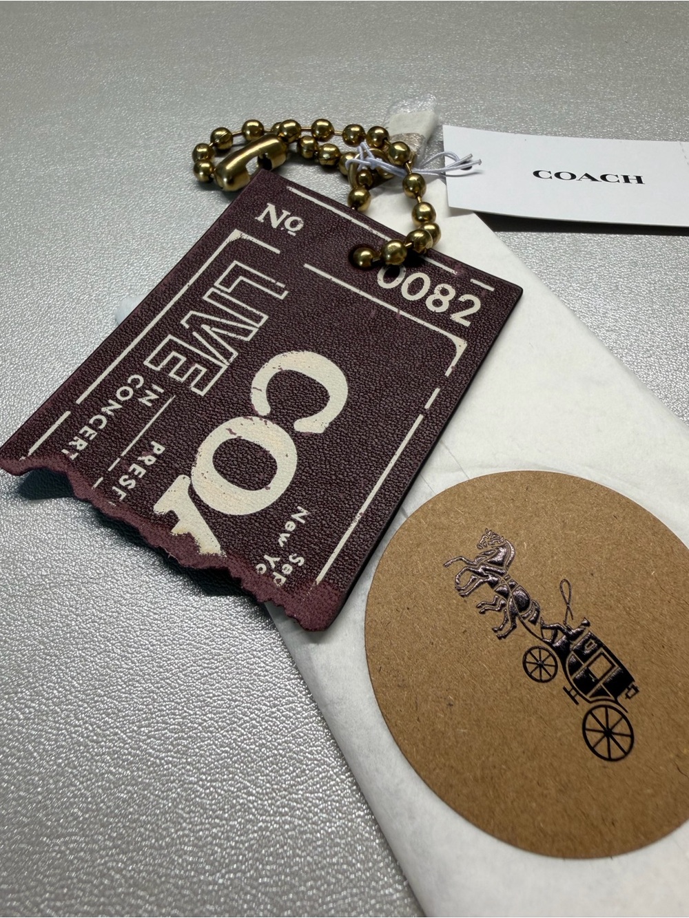 Coach Live In Concert Bag Charm
Brass/Merlot